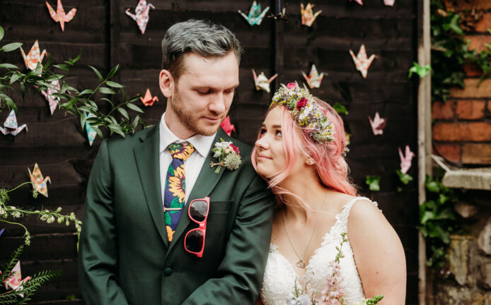 Bride and Groom looking sweetly at each other during their colourful, humanist wedding ceremony