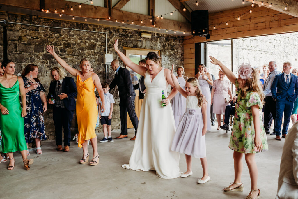 Rosedew Farm Wedding - Bride & guests dancing